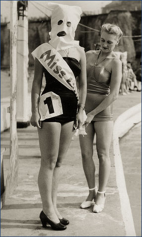 beauty pageant contestant with bag on her head