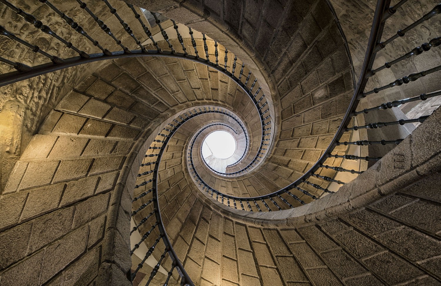 looking up at a spiral staircase